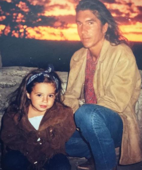 Mariah Lynch with her dad in an childhood image