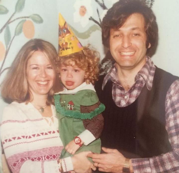 Childhood image of Jill Martin with her mother and father