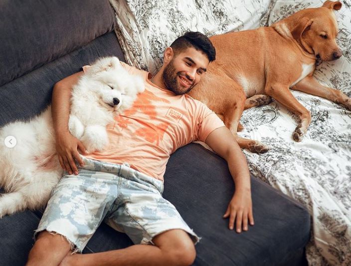 Marco Espejo with his two pet dogs