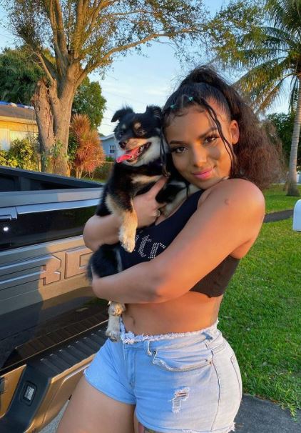 Mikayla Saravia with her pet dog