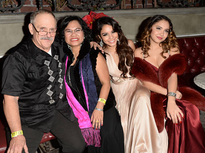 Stella Hudgens with her parents