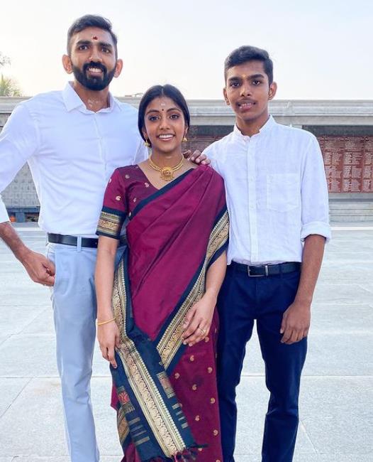 Charithra Chandran with her brothers