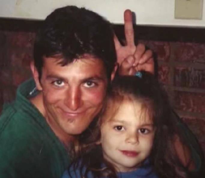 Childhood image of Skilyr Hicks with her father