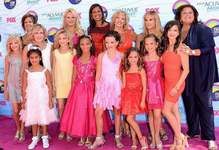 Kelly Hyland with Dance Moms team