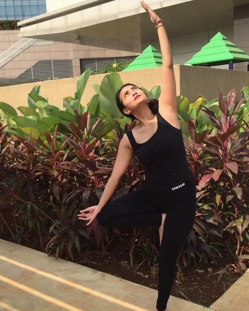 Vanessa Angel doing yoga