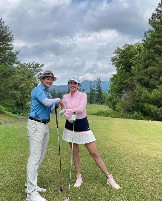 Vanessa Angel playing golf