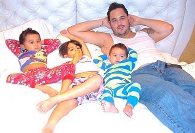 Raphy Pina old picture with his three kids