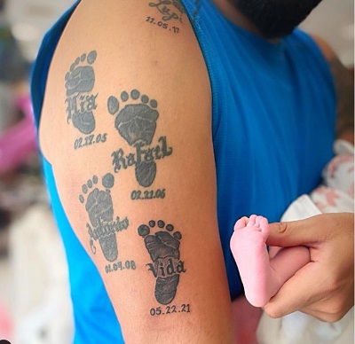 Raphy Pina's kids's footprint tattoos