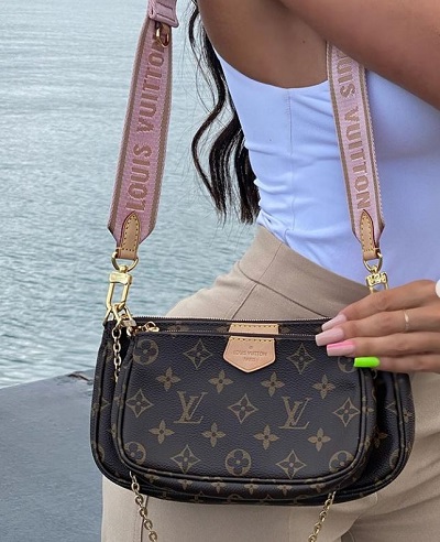 Aurah Ruiz with her branded LV bag