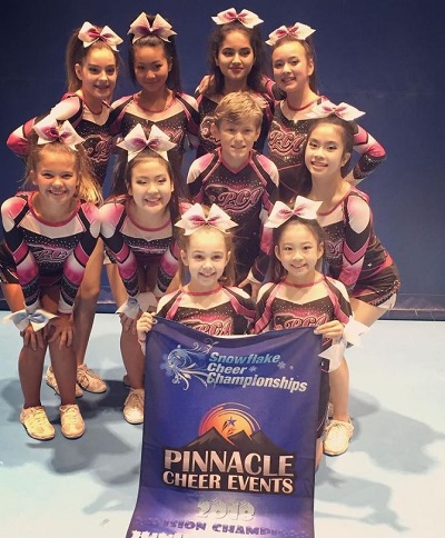 London Robertson with her Cheerleading team