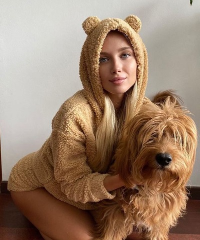 Polina Malinovskaya with her pet dog