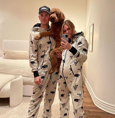 Jason Kennedy with his wife Lauren Scruggs and pet
