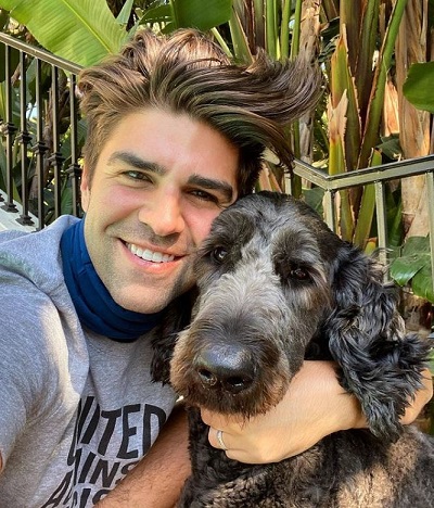 Justin Mikita with his pet dog