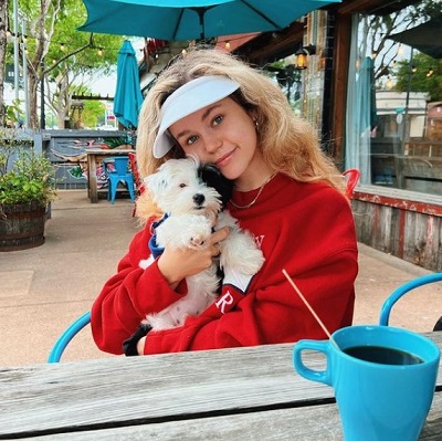 Brec Bassinger with her dog