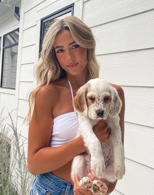 Lilia Schneider likes to play with her pet dog