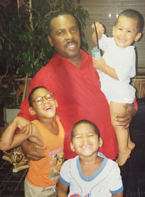 An old image of Eric Ortiz with his father and siblings