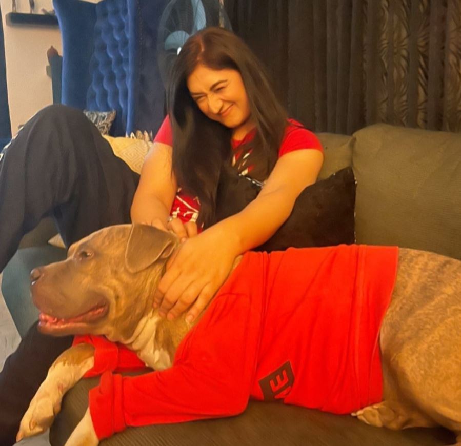 Madiha with her dog