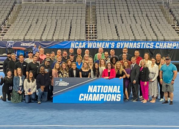 Nicole Pechanec with her gymnastics team members