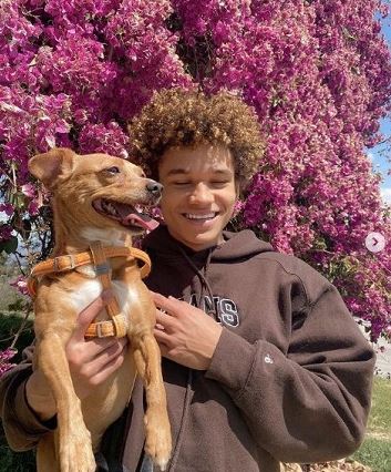 Armani Jackson with his dog Chelsea
