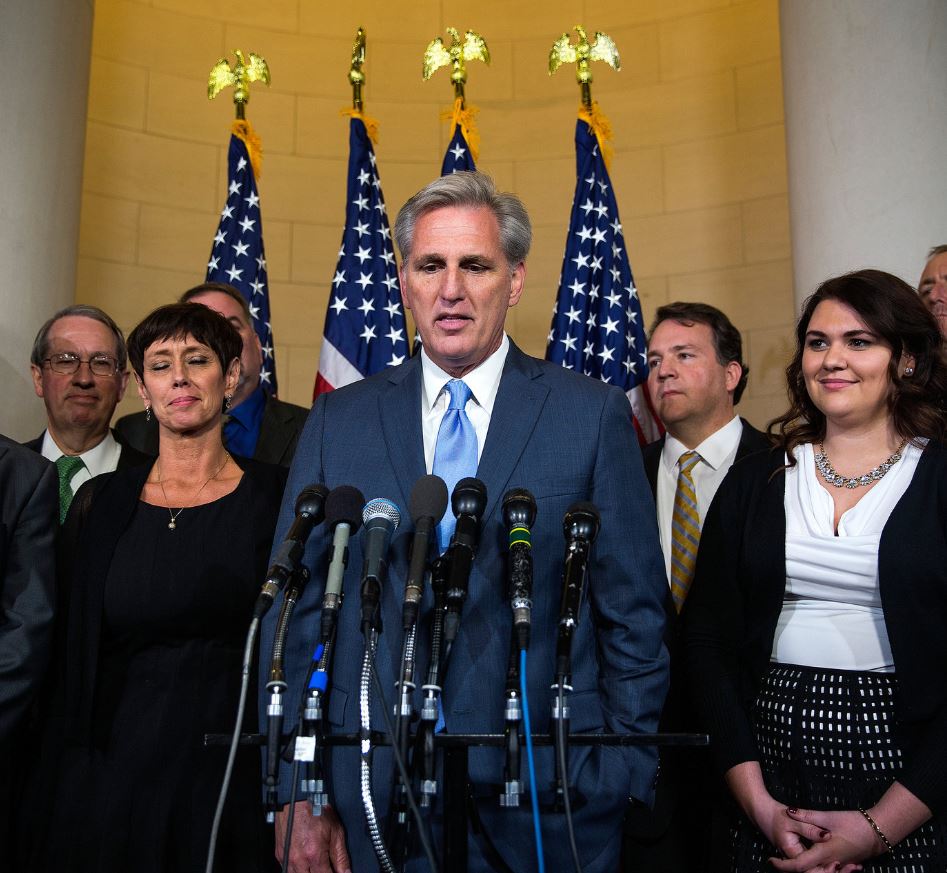 Judy McCarthy with her husband at a press conference