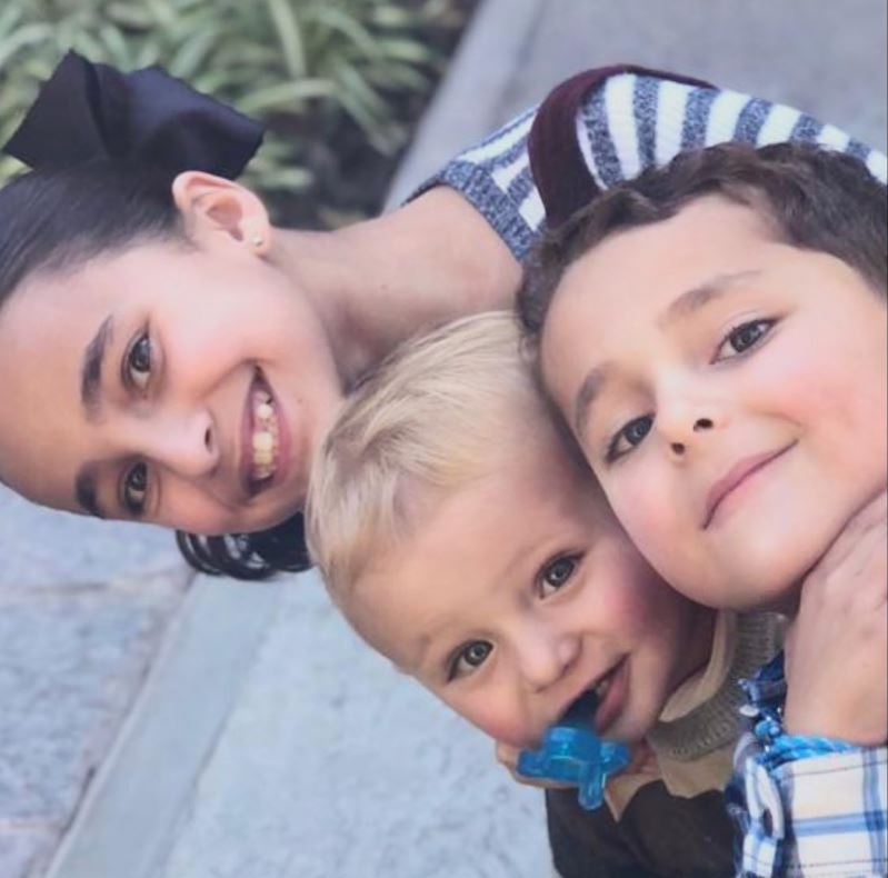 Mariandrea Villegas with her brothers