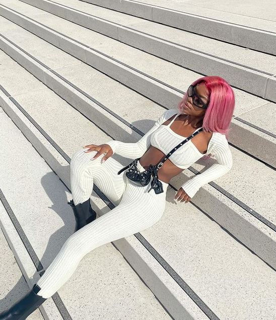 Tanya Manhenga wears different colored wigs