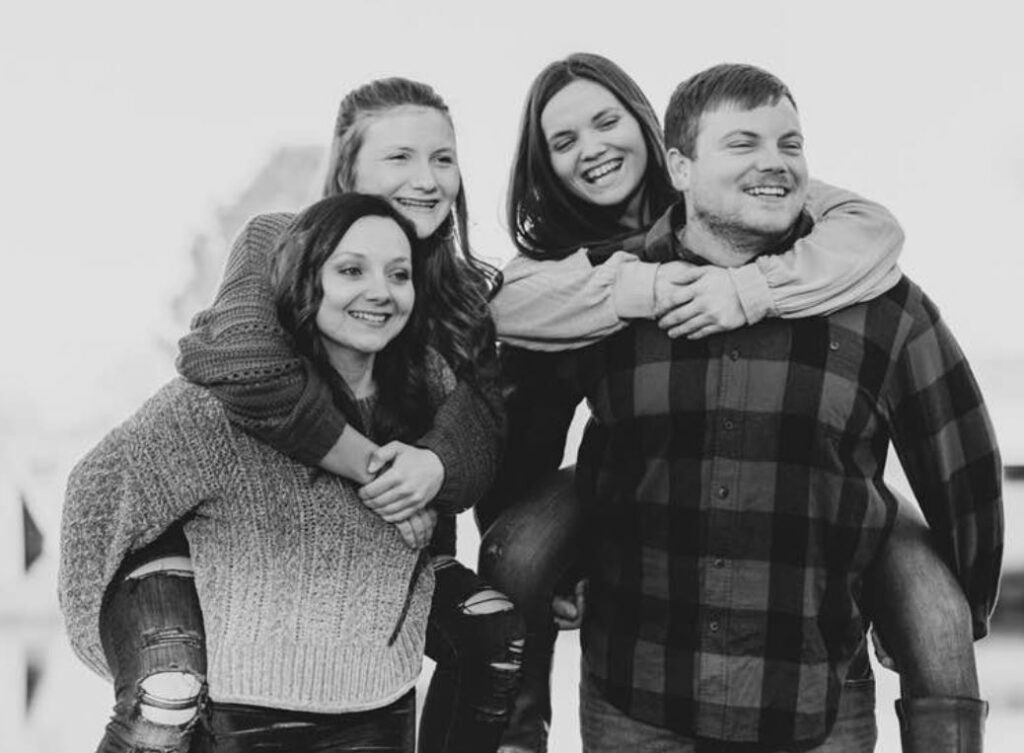 Megan Danielle with her siblings Kaila Phillips, Whitney Phillips, and Austin Phillips
