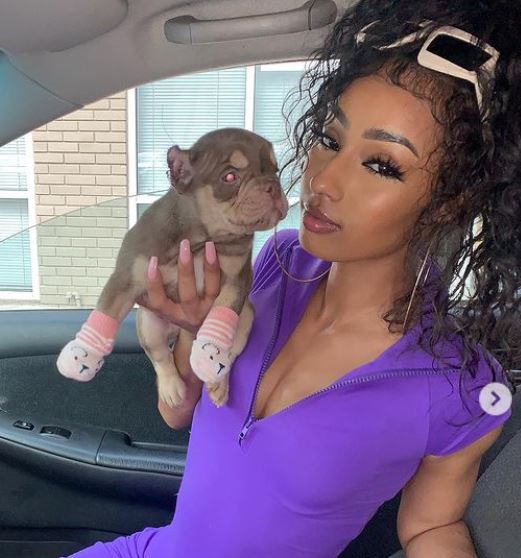 Rubi Rose with her dog