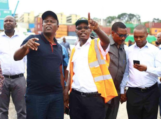 William Kipkemboi Ruto with staff members