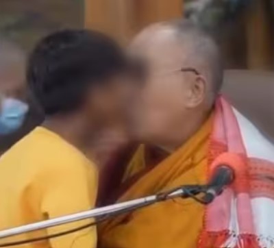 Dalai Lama kissing a minor boy